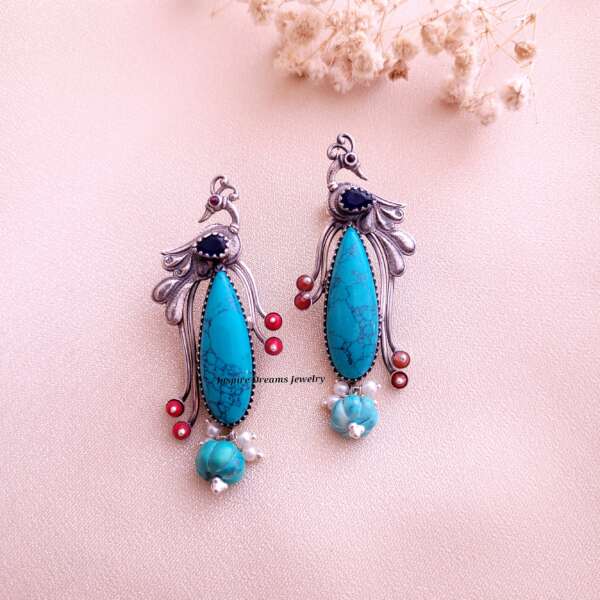 LONG TAILED PARADISE  BIRD WITH TURQUOISE CORAL EARRING .