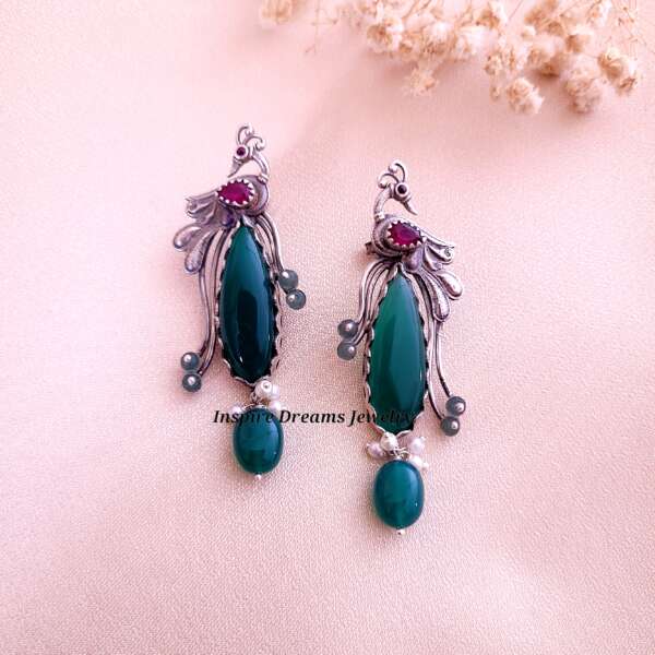 LONG TAILED PARADISE BIRD EARRING WITH GREEN STONE AND RUBY.